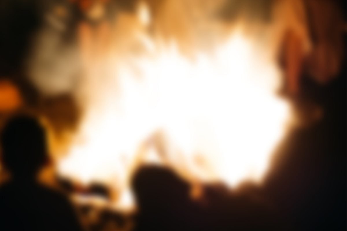People gathered around a bonfire